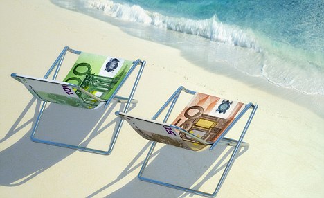 Two deckchairs on beach