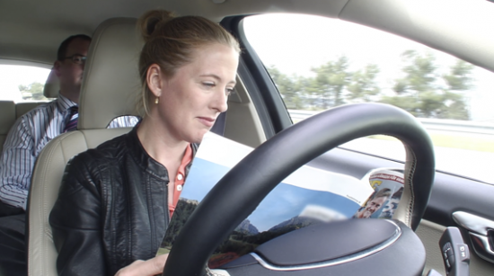 Reading at the wheel of a Volvo self-driving car