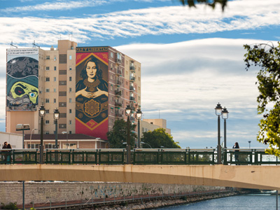 Two signature 7-storey murals adorn an apartment block in Málaga